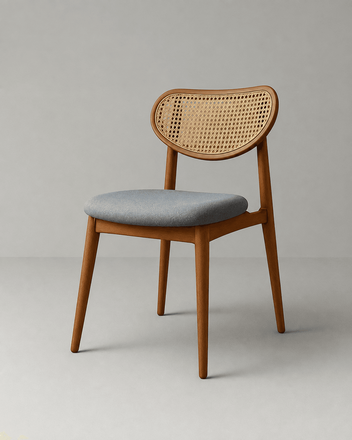 CANEVA premium dining chair with natural cane backrest, grey upholstered seat and warm walnut wooden frame.
