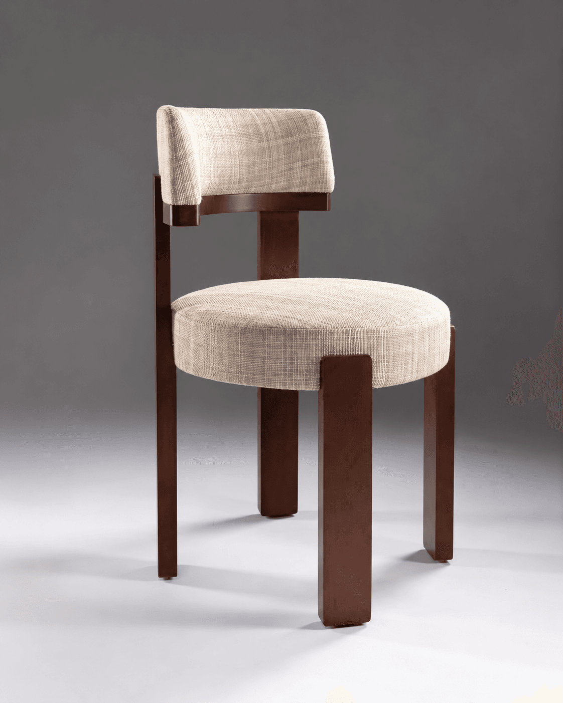 MIRAÉ premium dining chair with a dark walnut wooden frame, cream upholstered seat and floating backrest in a contemporary studio setting.