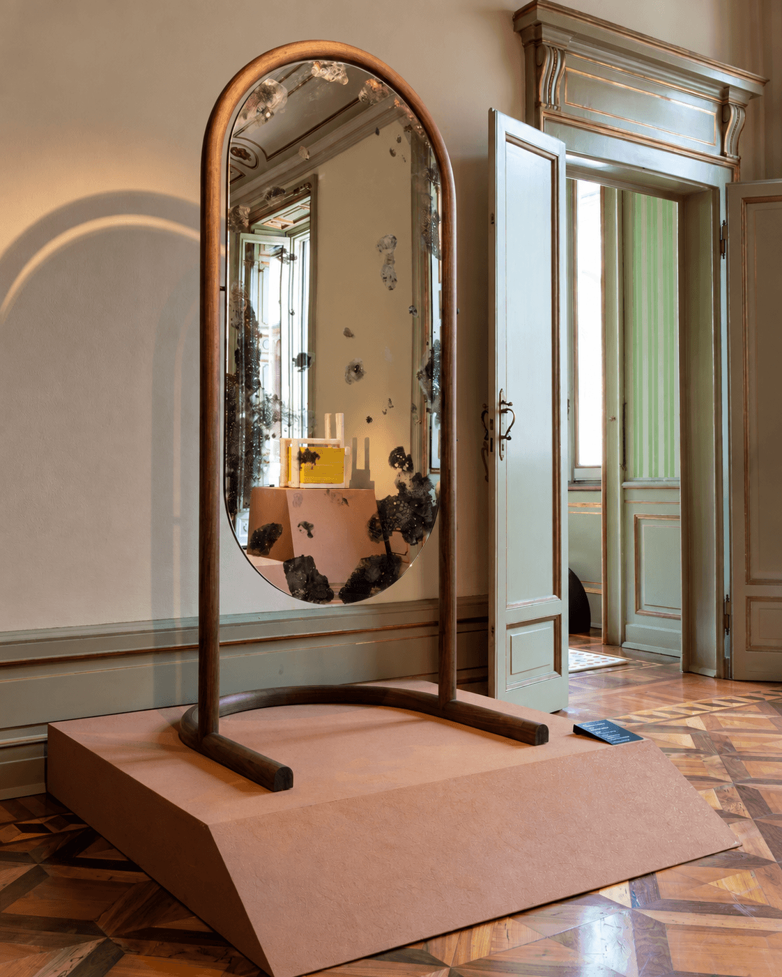 PATINA solid wood arched floor mirror in an elegant interior