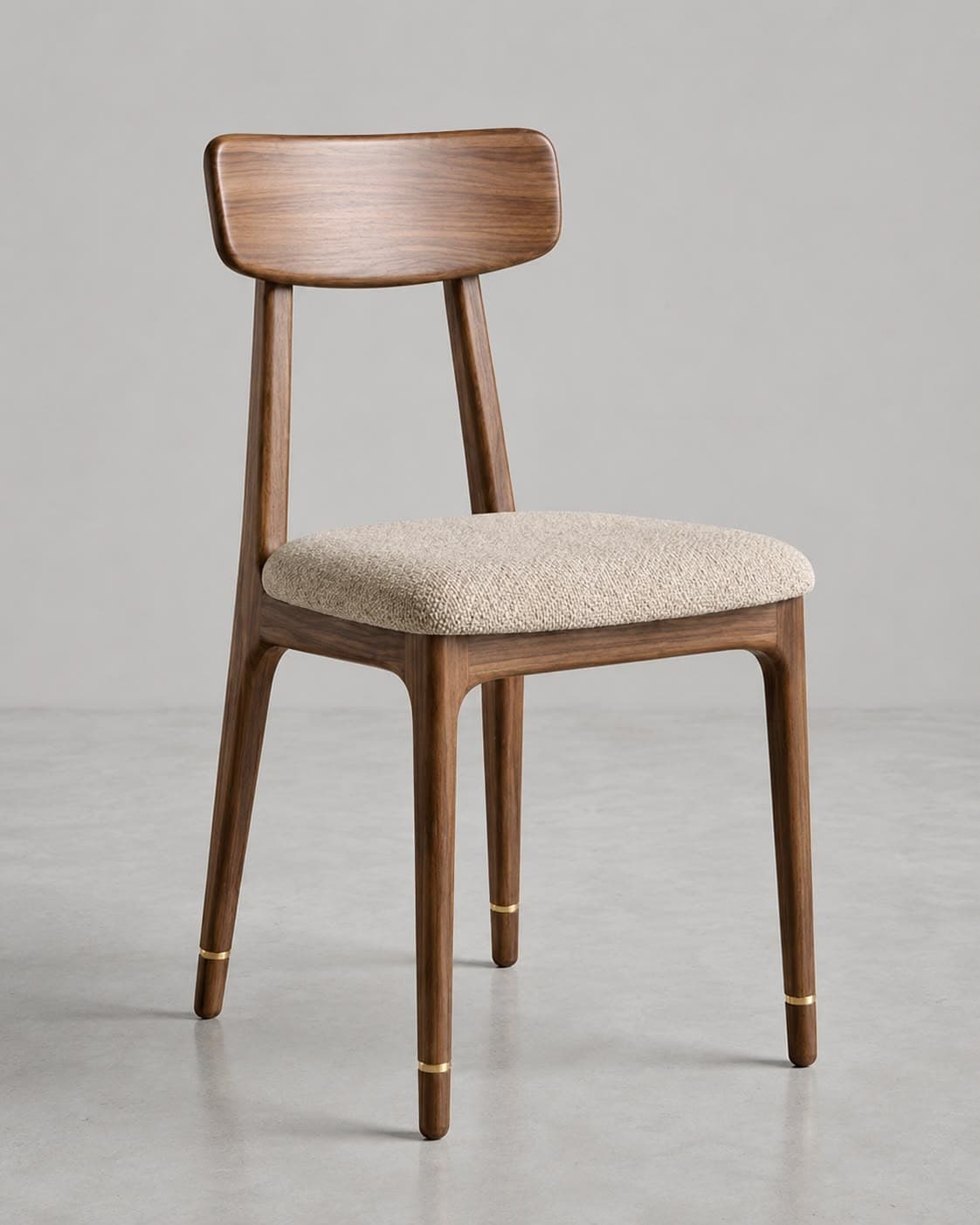 SENA premium wooden dining chair with rounded walnut backrest, beige upholstered seat and tapered wooden legs with brass accents.