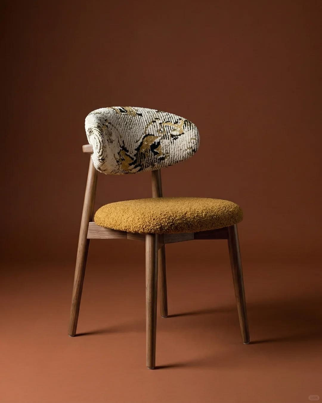 ORLA premium dining chair with a natural wooden frame, mustard textured seat and patterned upholstered backrest in a warm interior setting.