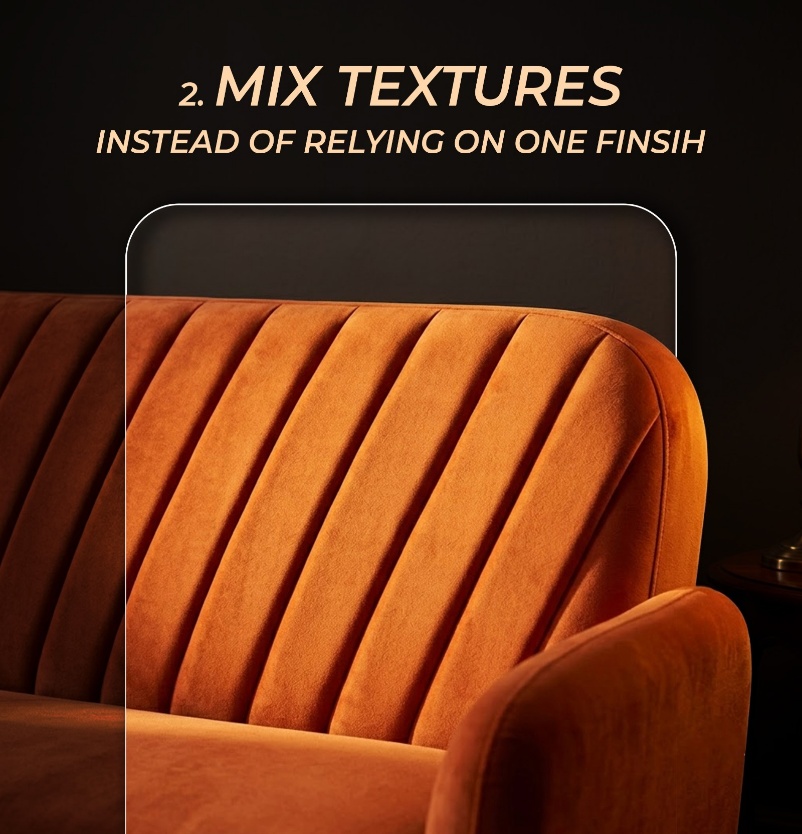 A close-up of a burnt-orange channel-tufted velvet sofa